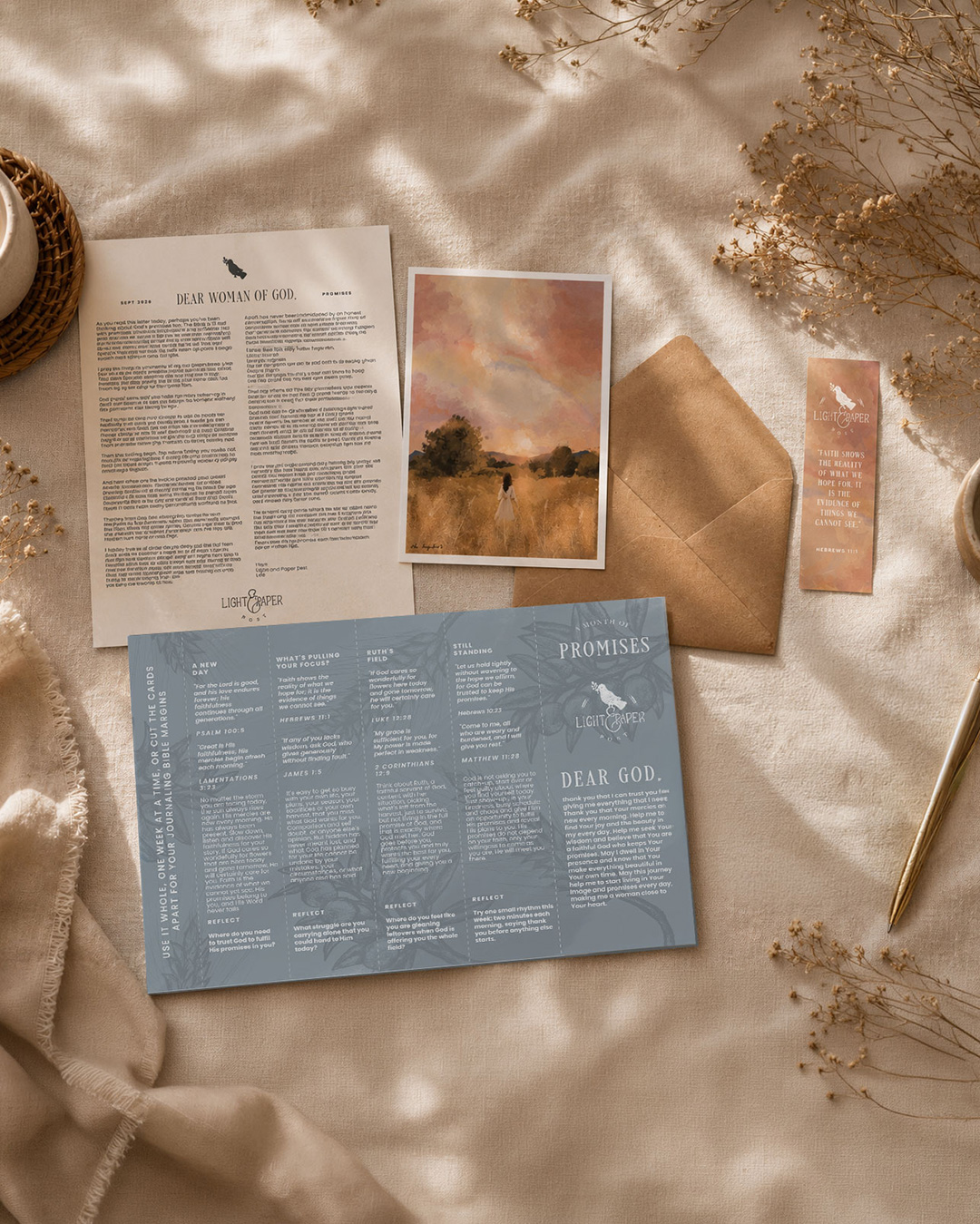 This month's themed letter, artwork print, envelope, and keepsakes laid out together